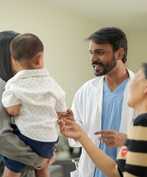 hospital story A kind doctor who treats pediatric patients. The child and his family brought him to see the doctor at the hospital because he was ill.